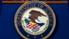 FILE - The Justice Department seal is seen in Washington, Nov. 28, 2018. A suspected participant in a ransomware scheme has been charged in the United States, the department said Nov. 10, 2022. Mikhail Vasiliev was arrested Wednesday.