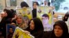 Relatives of Palestinian prisoners held in Israeli jails hold a protest demanding their release in front of the Red Cross office in Gaza City, Oct. 28, 2013.