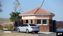 A car carrying elders of the Mandela family is seen outside the former state president's home in Qunu on June 25, 2013. 