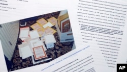 Pages from a Department of Justice court filing on Aug. 30, 2022, in response to a request from the legal team of former President Donald Trump for a special master to review the documents seized during the Aug. 8 search of Mar-a-Lago, are photographed early on Aug. 31, 2022. 