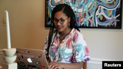 Jaleesa Garland, a marketing manager at an e-commerce startup, works in her apartment in Tulsa, Oklahoma, July 9, 2021.