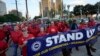 UAW Leaders Push Ahead With Ford Contract as GM Talks Drag