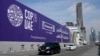 Cars pass by a billboard advertising COP28 at Sheikh Zayed Highway in Dubai, United Arab Emirates, Nov. 27, 2023.