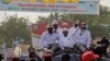 Chad's transitional incumbent president and presidential candidate for the party 'Coalition pour un Tchad Uni' General Mahamat Idriss Deby (C) waves to his supporters during the launch of his presidential campaign in N'Djamena, April 14, 2024.