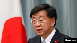 FILE - Chief Cabinet Secretary Hirokazu Matsuno in Tokyo, Japan, Oct. 4, 2021. 