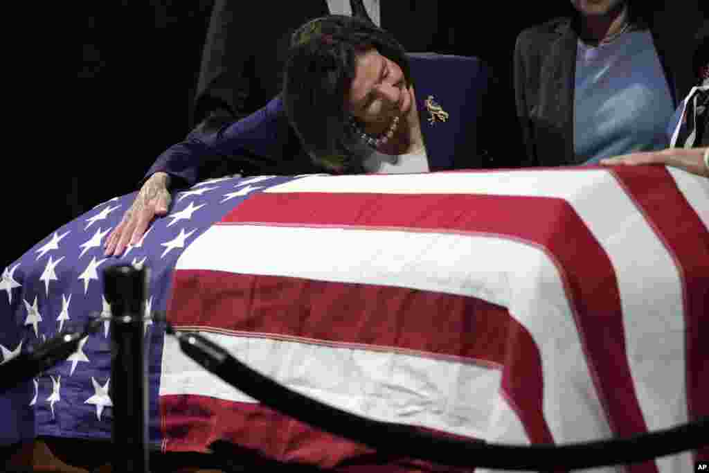 U.S. Rep. Nancy Pelosi, D-Calif., puts her arm around the casket of the late Sen. Dianne Feinstein at City Hall, Oct. 4, 2023, in San Francisco.&nbsp;&nbsp;Feinstein&#39;s body will lie in state at San Francisco City Hall. Feinstein, who died Sept. 29, served as San Francisco&#39;s mayor.&nbsp;