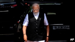 Indian Prime Minister Narendra Modi arrives on the opening day of the monsoon session of the Indian parliament in New Delhi, July 20, 2023.