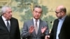 Mahmoud al-Aloul, Vice Chairman of the Central Committee of Palestinian organization and political party Fatah, China's Foreign Minister Wang Yi, and Mussa Abu Marzuk, senior member of Hamas, attend an event in Beijing on July 23, 2024.