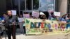 FILE - Demonstrators gather at a rally outside the federal courthouse following a hearing on the fate of a revised version of the Deferred Action for Childhood Arrivals, or DACA, program, in Houston, June 1, 2023.