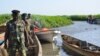 FILE - Cameroonian soldiers arrive in Darak as they patrol Lake Chad, March 1, 2013. At least 12 people have been killed in Darak in attacks by Boko Haram militants since Tuesday, authorities say.