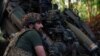 A Ukrainian serviceman prepares to fire a howitzer toward Russian troops near the front line in Donetsk region, Ukraine May 1, 2024. 