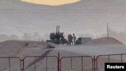 FILE - Military personnel stand guard at a nuclear facility in the Zardanjan area of Isfahan, Iran, April 19, 2024, in this screen grab taken from video. (West Asia News Agency via Reuters) 