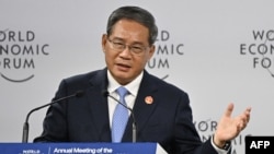 FILE - Chinese Premier Li Qiang delivers his speech during the opening ceremony of the World Economic Forum Annual Meeting of the New Champions in Dalian, in China's northeastern Liaoning province, June 25, 2024.