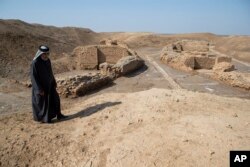 What is considered a world's oldest bridge , some 4,000 years-old is seen by the ancient city-state of Lagash, near Nasiriyah, Iraq, Thursday, Feb. 23, 2023.
