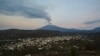 Ash and smoke billow from the Popocatepetl volcano as seen from the Santiago Xalitzintla community, state of Puebla, Mexico, on May 24, 2023. 