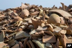 Shards of pottery are seen at the site of a 5,000-year-old ancient city-state of Lagash, near Nasiriyah, Iraq, Thursday, Feb. 23, 2023.