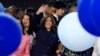 Democratic presidential nominee Vice President Kamala Harris waves surrounded by balloons at the Democratic National Convention, Aug. 22, 2024, in Chicago. 