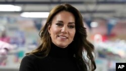 FILE - Britain's Kate, Princess of Wales, smiles during her visit to Sebby's Corner in north London, Nov. 24, 2023. Kate apologized on March 11, 2024, for “confusion” caused by her editing of a family photo released by the palace.