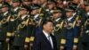 资料照片: 2023年9月30日中国国家主席习近平人民英雄纪念碑献花，纪念烈士纪念日，身后是中国人民解放军官兵