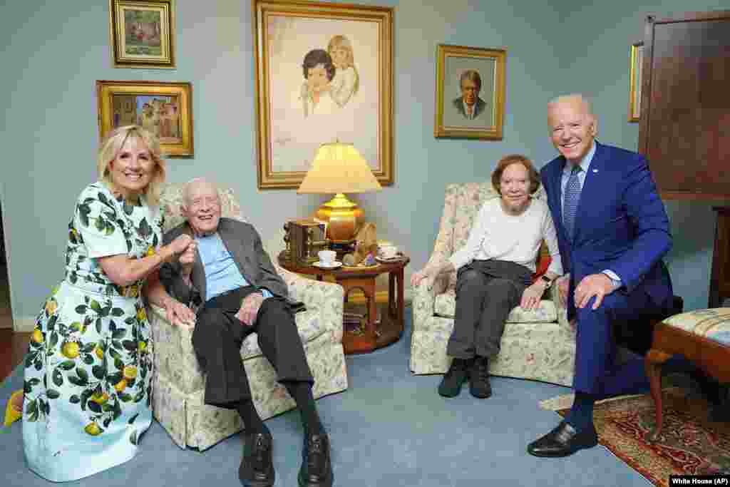 Former President Jimmy Carter and former first lady Rosalynn Carter pose for a photo with President Joe Biden and first lady Jill Biden at the home of the Carter's in Plains, Georgia, April 30, 2021.