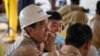 FILE - Workers from China Oilfield Services Limited, a contractor for China National Offshore Oil Corp., attend the start of drilling at the Kingfisher oil field in Uganda, Jan. 24, 2023. The number of Chinese workers in Africa has fallen in recent years.