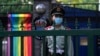 A Chinese paramilitary policeman stands guard outside the Swedish Embassy during Diversity Week in Beijing, May 12, 2023. On May 15, 2023, the advocacy group know as the Beijing LGBT Center became the latest organization to close under a government crackdown.