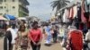 People browse at a market on the side of a road in Libreville on Sept. 2, 2023. Gabon's army said on Sept. 2, 2023, that it would reopen the country's borders, closed in the wake of the military coup that ousted ex-president Ali Bongo Ondimba.