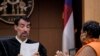 County Clerk Che Alexander, right, speaks with Fulton County Superior Court Judge Robert McBurney in Atlanta, Aug. 14, 2023.
