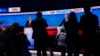 Photographers take photos of President Joe Biden, right, and Republican presidential candidate former President Donald Trump, left, during a break in a presidential debate hosted by CNN, June 27, 2024, in Atlanta. 