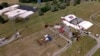 FILE - The Butler Farm Show, site of a rally for Republican Donald Trump, is seen July 15, 2024 in Butler, Pa. Trump was wounded July 13 at the rally; a shooter reportedly was atop the building farthest to the right in the cluster of buildings at left.