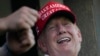 Mantan Presiden AS Donald Trump tampak tertawa ketika berpartisipasi dalam turnamen golf invitasi Bedminster Invitational LIV Golf di Bedminster, New Jersey, pada 13 Agustus 2023. (Foto: AP/Seth Wenig)