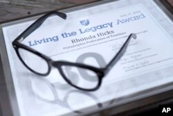 The Living the Legacy award given to Rhonda Hicks is shown at her home in Philadelphia, Thursday, July 20, 2023. The award is from the American Federation of Teachers in recognition of 30 years of exceptional leadership and union advocacy in support of women's rights. (AP Photo/Michael Perez)