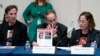 From left, Ruby Chen, father of kidnapped Israeli soldier Itay Chen, and Ronen and Orna Neutra, parents of Omer Neutra, join families of hostages and victims of the Hamas attacks at a House Foreign Affairs Committee session in Washington, Nov. 29, 2023.