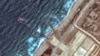 FILE - This handout satellite image courtesy of Maxar Technologies shows the U.S.-built Trident Pier on the coast of Gaza on May 26, 2024.