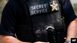 FILE - A Secret Service agent is pictured in New York, July 20, 2022. An independent panel has concluded that because of a static internal culture, the agency "does not perform at the elite levels needed to discharge its critical mission." 