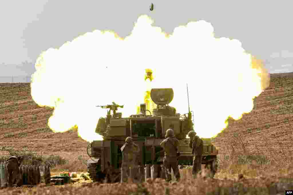 An Israeli army self-propelled howitzer fires rounds near the border with Gaza in southern Israel.&nbsp;Israel declared war on Hamas on October 8 following a shock land, air, and sea assault by the Gaza-based militant group.&nbsp;