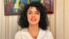 FILE - Iranian human rights activist Narges Mohammadi poses in this undated handout picture. 