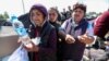 Refugees from Nagorno-Karabakh region arrive at the border village of Kornidzor, Armenia, Sept. 27, 2023. 