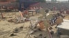 This screen grab taken from a social media video shows the aftermath of an explosion by a suicide bomber in Bajaur district, Pakistan, July 31, 2023. People were said to be sitting under a large tent, listening to a speaker, when the explosives went off. (Bilal Yasir/via Reuters)