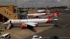 Des avions de Kenya Airways à l'aéroport international Jomo Kenyatta de Nairobi, le 1er août 2020. REUTERS/Njeri Mwangi