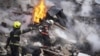 Rescuers work the scene of a building damaged by Russian rocket in Kharkiv, Ukraine, Jan. 23, 2024. On the same day, U.S. lawmakers said a deal on border security in return for Republican votes to send nearly $60 billion in aid to Ukraine is nearing completion.