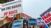 People protest outside of the Supreme Court in Washington, June 29, 2023. 