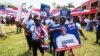 Supporters hold a placard depicting Mahamudu Bawumia, vice president of Ghana and presidential candidate of the New Patriotic Party NPP for the 2024 presidential elections, in Takoradi, Ghana, Aug. 18, 2024.