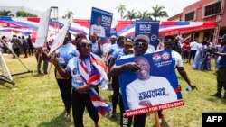 Supporters hold a placard depicting Mahamudu Bawumia, vice president of Ghana and presidential candidate of the New Patriotic Party NPP for the 2024 presidential elections, in Takoradi, Ghana, Aug. 18, 2024.