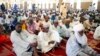FILE - Muslim faithful listen to a sermons by an Imam before traditional Friday prayers at the Moddibo Adama Mosque in Yola, Nigeria, Feb. 24, 2023. 