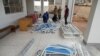 Ugandan Medical staff members assemble beds to be used in the Ebola treatment Isolation Unit at Mubende regional referral hospital in Uganda on Sept. 24, 2022.