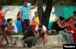 Relatives of prisoners await news of the fate of their loved ones, in front of the Medical Legal Institute, after a bloody prison riot in the Amazon jungle city of Manaus, Brazil, Jan. 2, 2017.