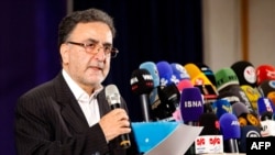 FILES - Iranian reformist politician Mostafa Tajzadeh speaks to the media after registering his candidacy in Tehran, for the upcoming presidential elections, May 14, 2021. He has been charged with "propaganda" against the state, local media said on Sept. 3 , 2024.