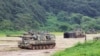 South Korean army K-9 self-propelled howitzers take positions in Paju, near the border with North Korea, South Korea, Aug. 22, 2022. The US and South Korea began their biggest combined military training in years Monday.