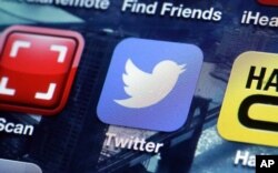 FILE - A Twitter app on an iPhone screen is shown.